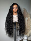A mannequin head displaying a wig with curly hair, wearing a white top with a heart pattern.